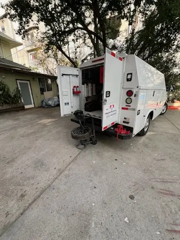 Magnet Plumbing service vehicle on-site for Water Heater Repair in Brown Arrow
